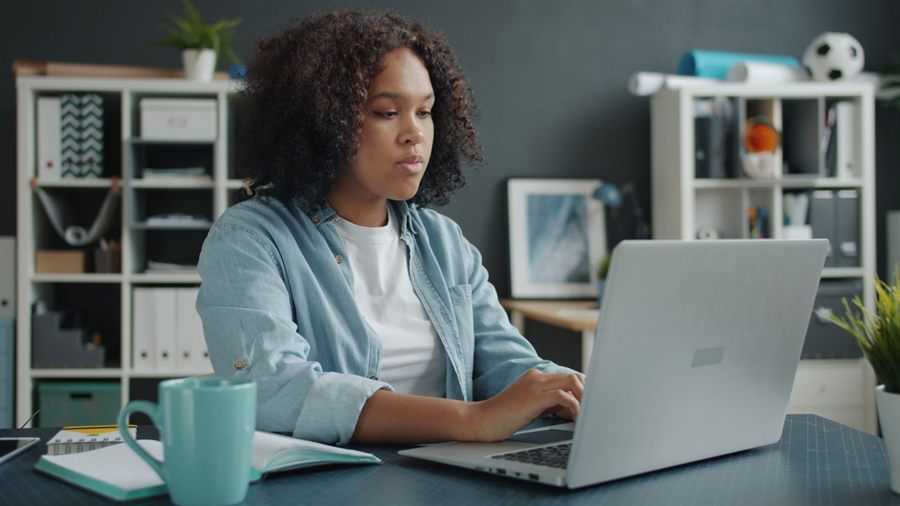 Typing at a tidy home desk